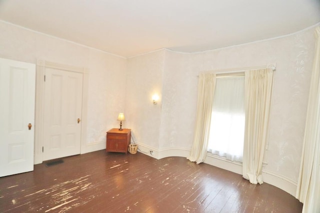 unfurnished room featuring wood-type flooring
