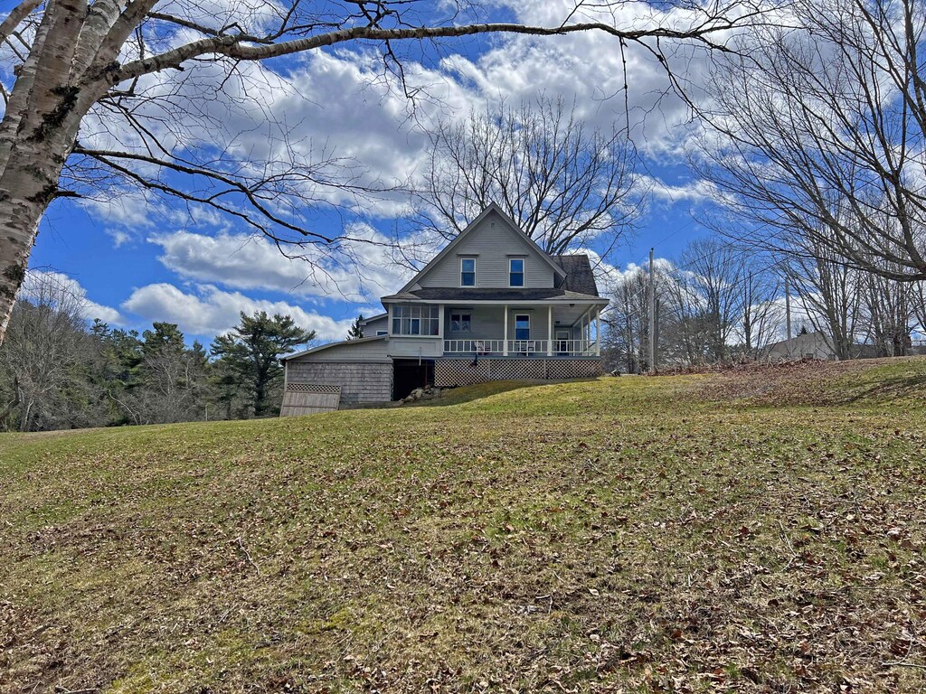 28 Fish Point Rd, Orland, ME 04472 - view of front of property featuring a front lawn and covered porch