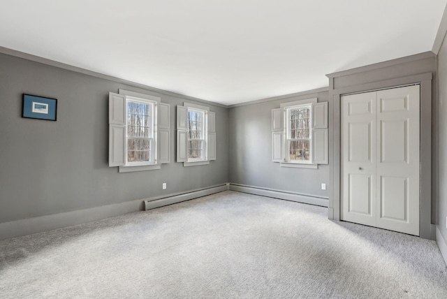117 Youngs Ridge Rd, Acton, ME 04001 - unfurnished bedroom featuring baseboards, carpet, a baseboard heating unit, and ornamental molding