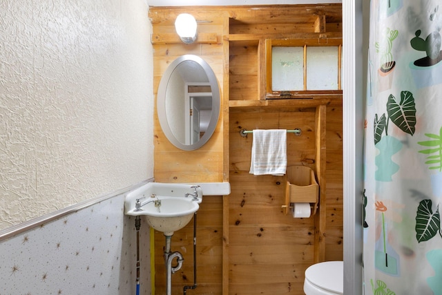 738 13th St, Acton, ME 04001 - full bathroom with toilet, a shower with curtain, a textured wall, and wooden walls