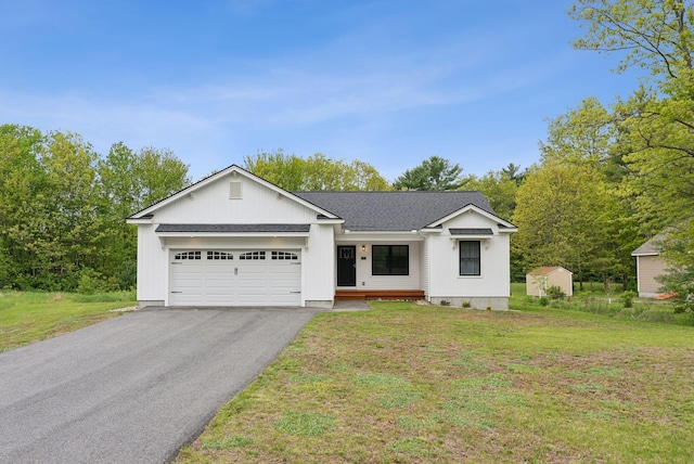 79 Colins Meadow Ln, Alfred, ME 04002 - single story home with driveway, a garage, a front lawn, and a shingled roof