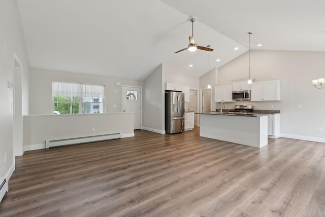 79 Colins Meadow Ln, Alfred, ME 04002 - unfurnished living room featuring a baseboard heating unit, high vaulted ceiling, a ceiling fan, wood finished floors, and a sink