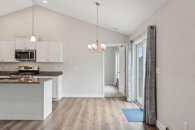 79 Colins Meadow Ln, Alfred, ME 04002 - kitchen with appliances with stainless steel finishes, vaulted ceiling, healthy amount of natural light, light wood-style flooring, and white cabinets