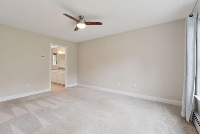 79 Colins Meadow Ln, Alfred, ME 04002 - unfurnished bedroom featuring light colored carpet, baseboards, connected bathroom, ceiling fan, and baseboard heating