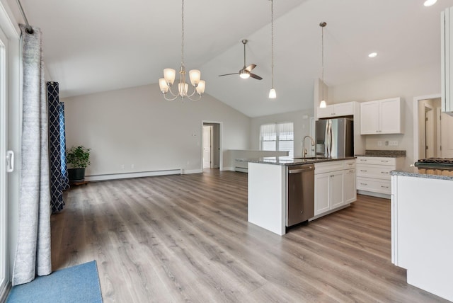 79 Colins Meadow Ln, Alfred, ME 04002 - kitchen with stainless steel appliances, a ceiling fan, a baseboard heating unit, a sink, and open floor plan