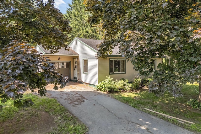 8 Sylvan Rd, Orono, ME 04473 - view of front of home featuring asphalt driveway and roof with shingles