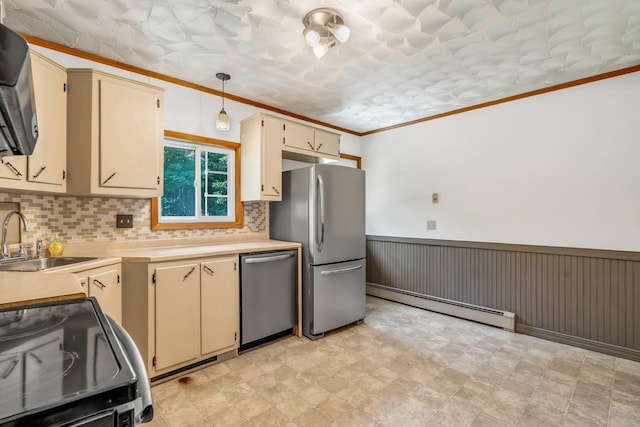8 Sylvan Rd, Orono, ME 04473 - kitchen featuring a baseboard heating unit, stainless steel appliances, cream cabinets, decorative backsplash, and crown molding