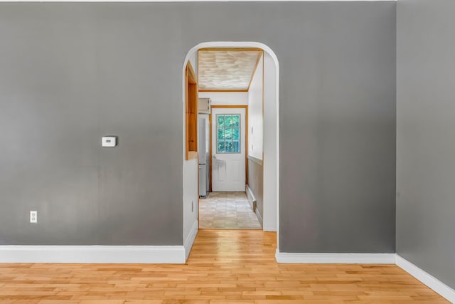 8 Sylvan Rd, Orono, ME 04473 - hallway with arched walkways, crown molding, and light wood-type flooring