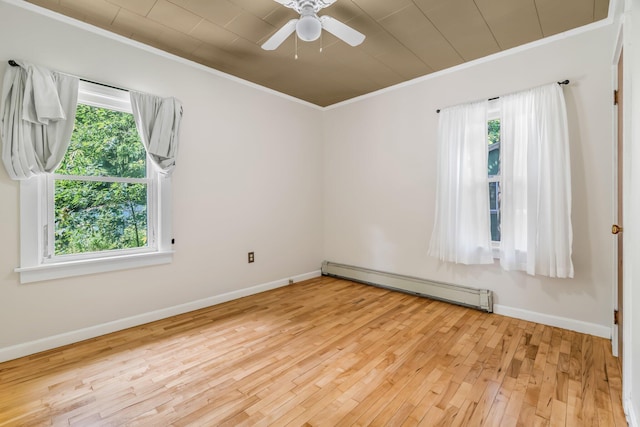 8 Sylvan Rd, Orono, ME 04473 - empty room with a baseboard radiator, crown molding, healthy amount of natural light, wood finished floors, and ceiling fan