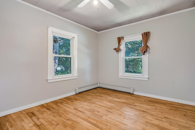 8 Sylvan Rd, Orono, ME 04473 - unfurnished room featuring ornamental molding, healthy amount of natural light, wood finished floors, a ceiling fan, and a baseboard heating unit