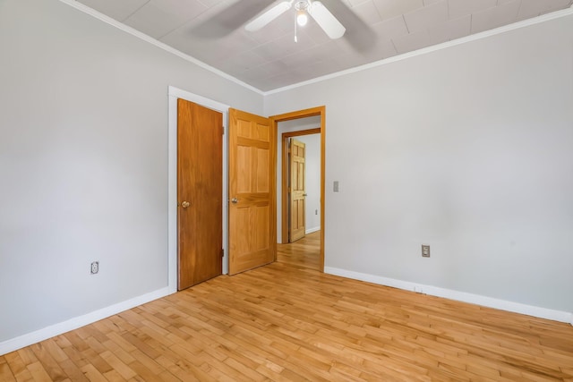 8 Sylvan Rd, Orono, ME 04473 - empty room with ornamental molding, a ceiling fan, and light wood-type flooring
