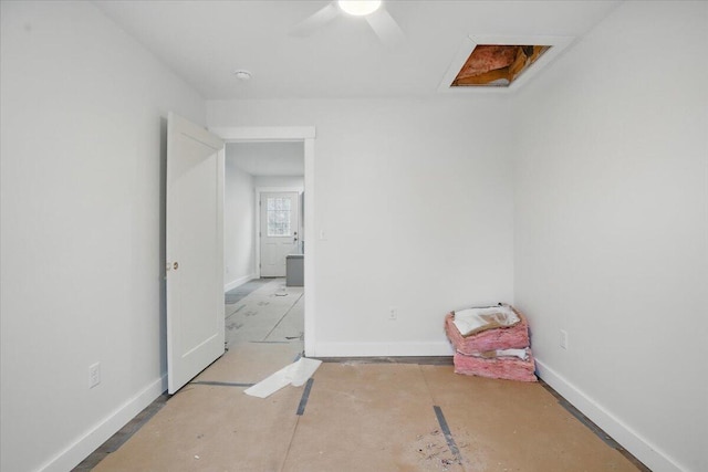 interior space with ceiling fan and baseboards