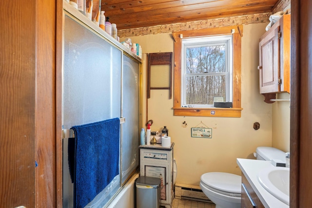 bathroom with toilet, a baseboard radiator, and vanity