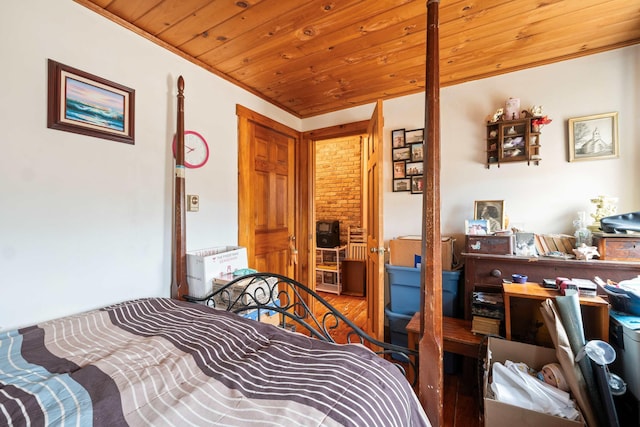 bedroom with wood ceiling and wood finished floors