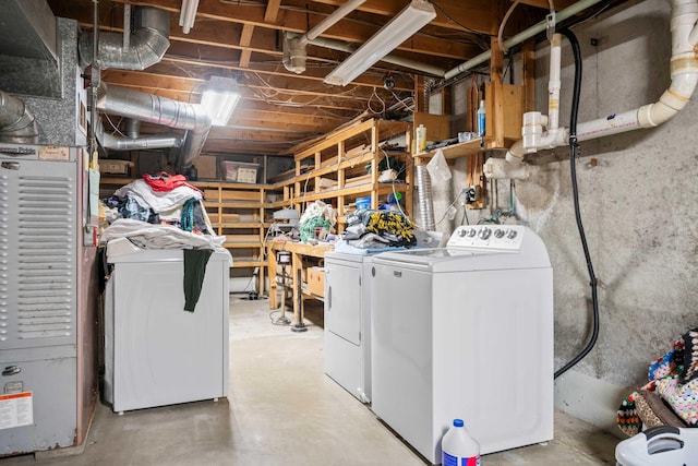 clothes washing area featuring laundry area and washing machine and clothes dryer