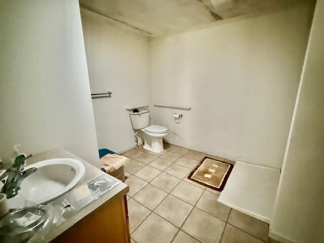 bathroom with tile patterned floors, vanity, and toilet