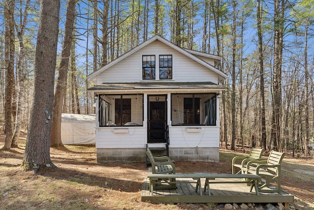 34 Jordan Shore Dr, Poland, ME 04274 - view of front of property with entry steps and a sunroom