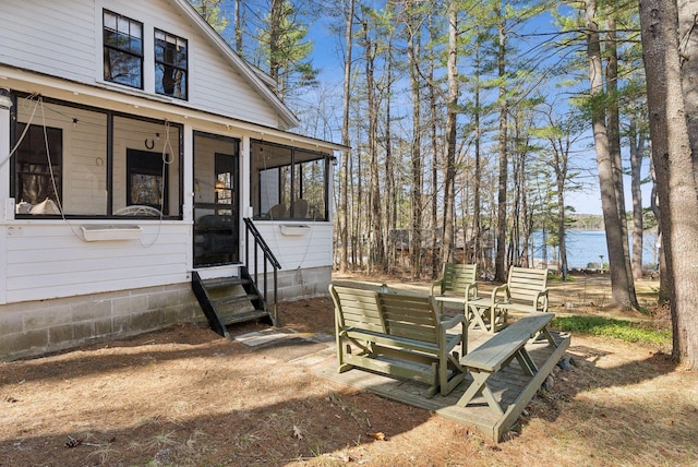 34 Jordan Shore Dr, Poland, ME 04274 - view of yard with entry steps, a sunroom, and a water view