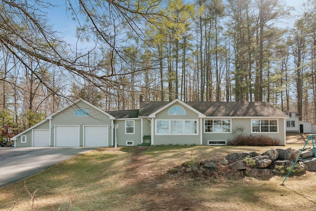 34 Jordan Shore Dr, Poland, ME 04274 - ranch-style home with an attached garage, aphalt driveway, and a front yard