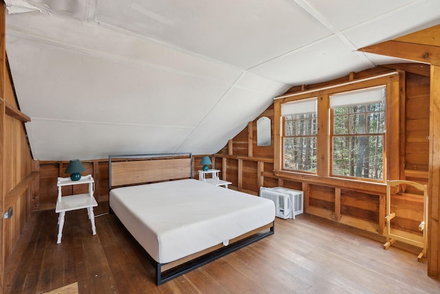 34 Jordan Shore Dr, Poland, ME 04274 - bedroom featuring lofted ceiling, hardwood / wood-style flooring, and wood walls