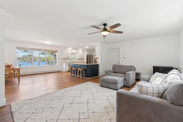 34 Jordan Shore Dr, Poland, ME 04274 - living area featuring ceiling fan and light wood-type flooring