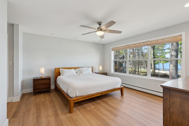 34 Jordan Shore Dr, Poland, ME 04274 - bedroom with recessed lighting, light wood finished floors, a baseboard heating unit, baseboards, and ceiling fan