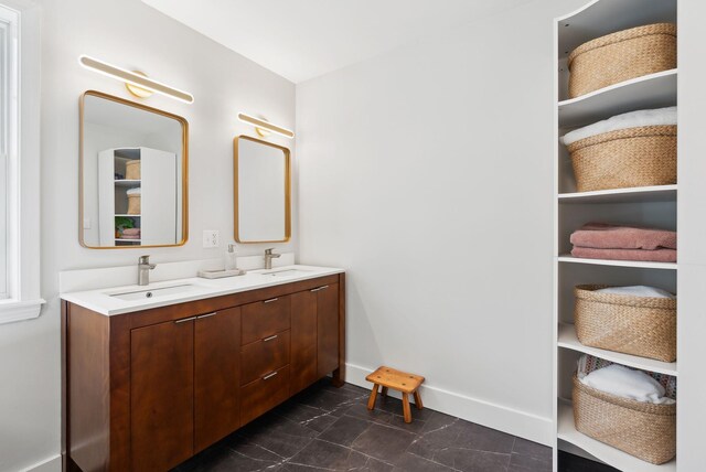 34 Jordan Shore Dr, Poland, ME 04274 - full bathroom with baseboards, marble finish floor, a sink, and double vanity