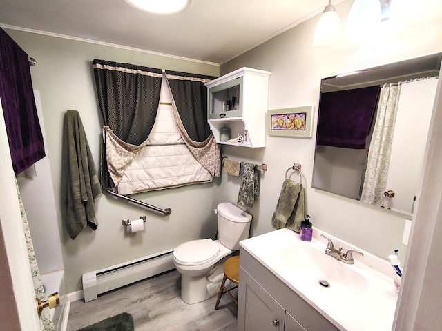 90 Whig St, Winterport, ME 04496 - full bathroom featuring a baseboard heating unit, wood finished floors, toilet, vanity, and crown molding
