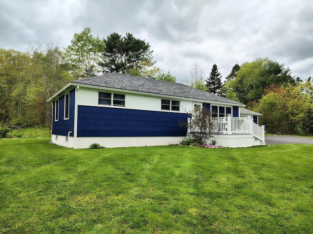 90 Whig St, Winterport, ME 04496 - single story home featuring a front lawn, a wooden deck, and a chimney