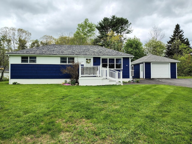 90 Whig St, Winterport, ME 04496 - view of front of home with a garage, an outbuilding, driveway, and a front yard