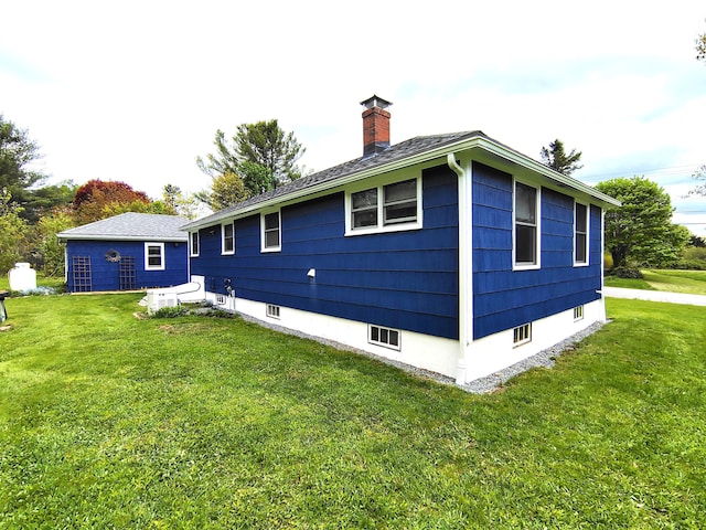 90 Whig St, Winterport, ME 04496 - back of house with a chimney and a lawn