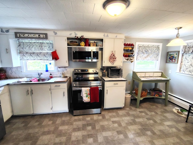 90 Whig St, Winterport, ME 04496 - kitchen featuring appliances with stainless steel finishes, a sink, white cabinetry, and light countertops