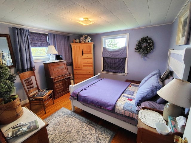 90 Whig St, Winterport, ME 04496 - bedroom with ornamental molding, multiple windows, and light wood-type flooring