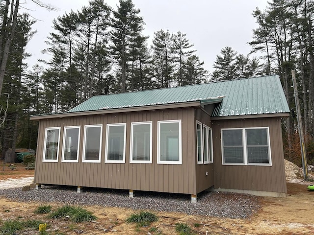 view of home's exterior with metal roof
