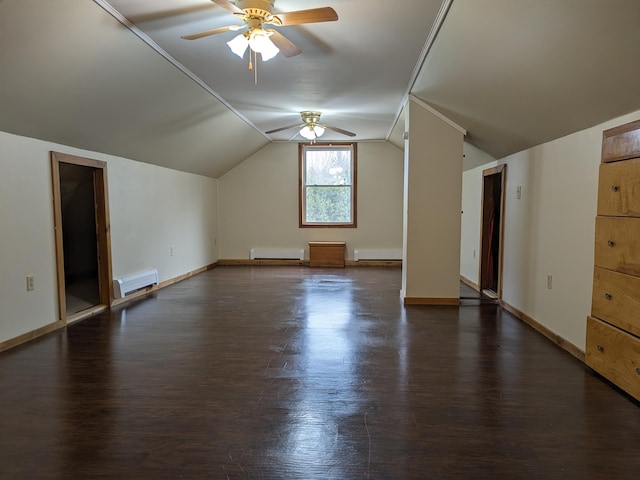 additional living space featuring a baseboard heating unit, a ceiling fan, lofted ceiling, and dark wood finished floors