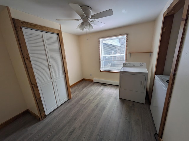 washroom with wood finished floors, ceiling fan, laundry area, and baseboards