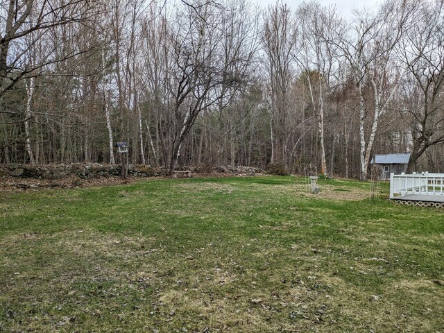 view of yard with a wooden deck