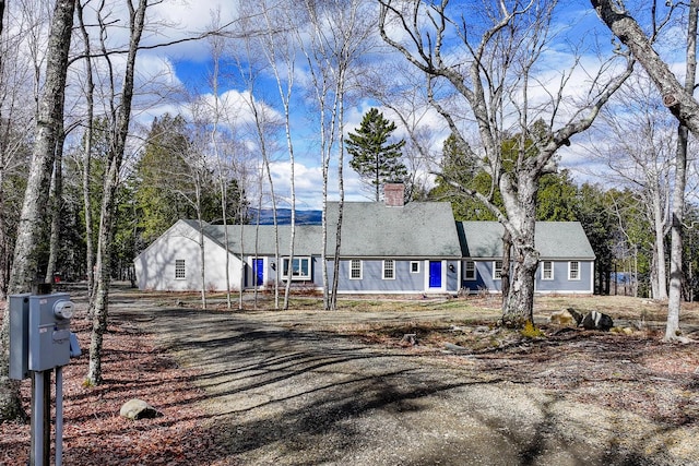view of front of home featuring a chimney