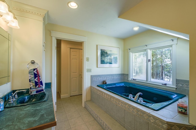 bathroom featuring a bath, tile patterned floors, vanity, and recessed lighting