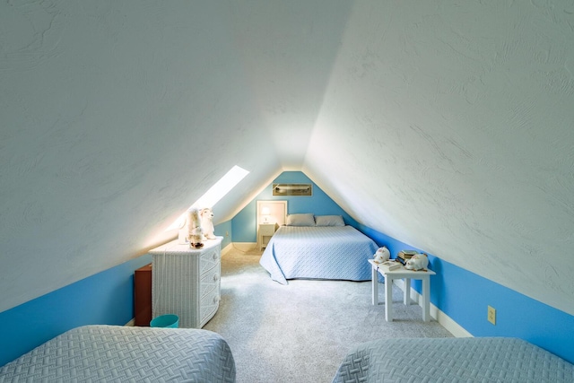 carpeted bedroom featuring vaulted ceiling and a textured ceiling