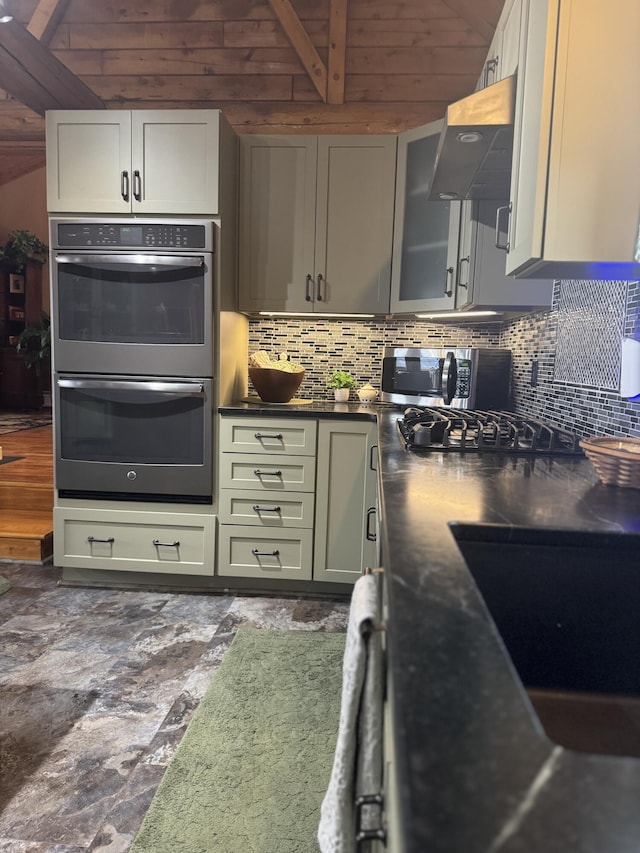 1083 N Rd, Ripley, ME 04930 - kitchen featuring dark countertops, backsplash, glass insert cabinets, and stainless steel appliances