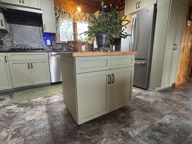 1083 N Rd, Ripley, ME 04930 - kitchen with freestanding refrigerator, gas cooktop, a kitchen island, wooden ceiling, and backsplash