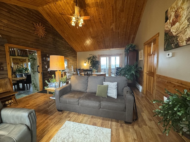 1083 N Rd, Ripley, ME 04930 - living area with a ceiling fan, baseboard heating, wood ceiling, wood finished floors, and wood walls