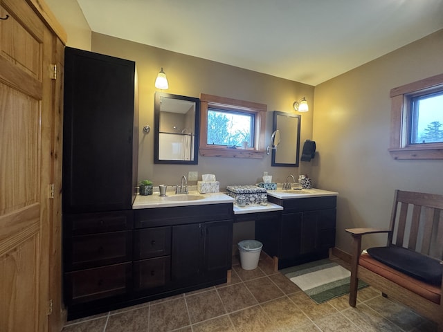 1083 N Rd, Ripley, ME 04930 - bathroom featuring a healthy amount of sunlight, two vanities, and a sink