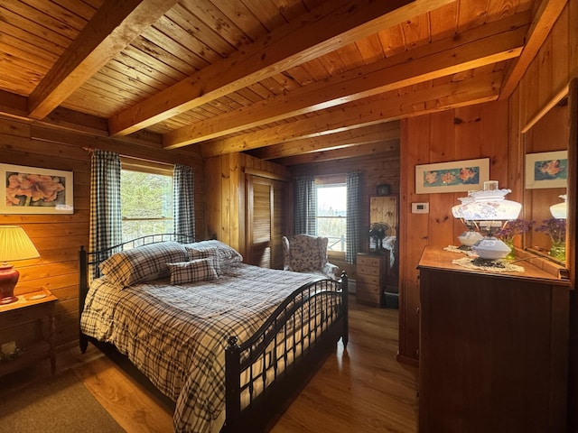 1083 N Rd, Ripley, ME 04930 - bedroom with wooden walls, beamed ceiling, wood finished floors, and wood ceiling