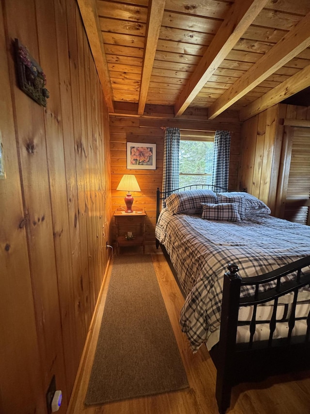 1083 N Rd, Ripley, ME 04930 - bedroom with beam ceiling, wood walls, wood finished floors, and wood ceiling