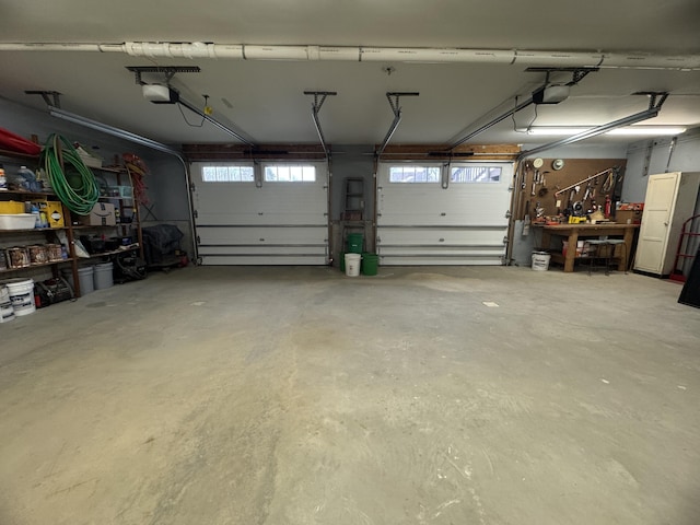 1083 N Rd, Ripley, ME 04930 - garage with a garage door opener and a workshop area