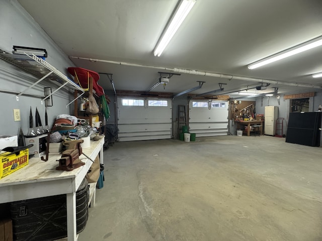 1083 N Rd, Ripley, ME 04930 - garage with a workshop area and a garage door opener