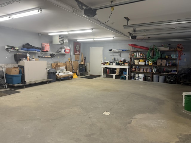 1083 N Rd, Ripley, ME 04930 - garage with a workshop area and a garage door opener
