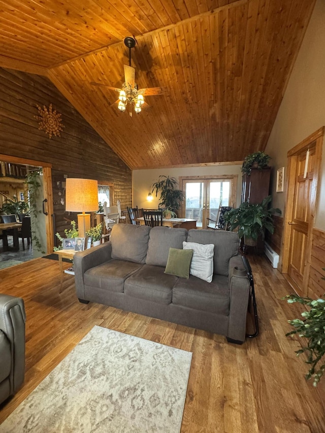 1083 N Rd, Ripley, ME 04930 - living area featuring wood ceiling, a baseboard radiator, a ceiling fan, and wood finished floors